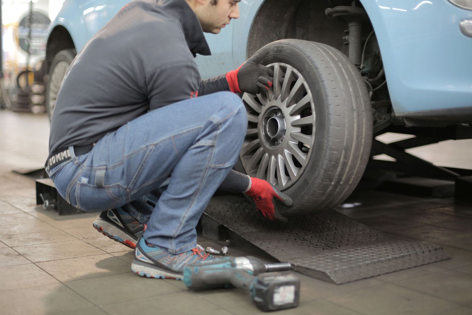 Mechanic providing roadside tire assistance